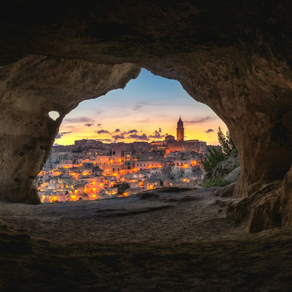 Cave framing Matera at sunset. Italy